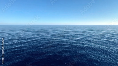 Serene surface of the ocean under clear blue sky during daytime