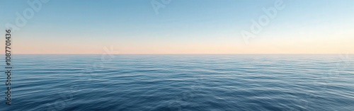 Tranquil ocean view at dusk with gentle waves and clear horizon
