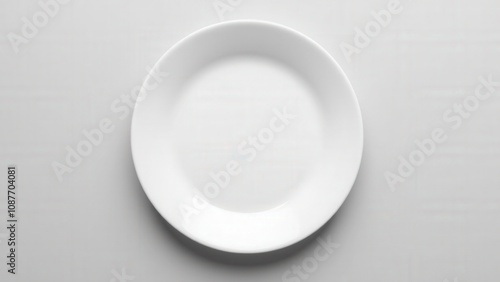 A photorealistic kitchenware plate mockup highlighting a smooth white surface for food or branding concepts.