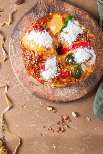 Bolo do Rei or King s Cake, Made for Christmas, Carnavale or Mardi Gras with Christmas season elements in Background. photo