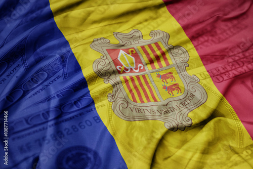 waving colorful flag of andorra on the dollar money background. finance concept. photo