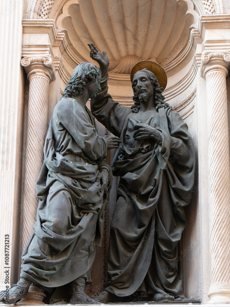 Fototapeta premium The statuary group of the Incredulity of Saint Thomas 1467-1483 by Andrea del Verrocchio in the external niches of the church of Orsanmichele in Florence, Italy.