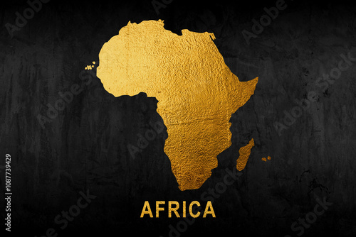 Photography Africa continent shaped from golden glitter on a black background