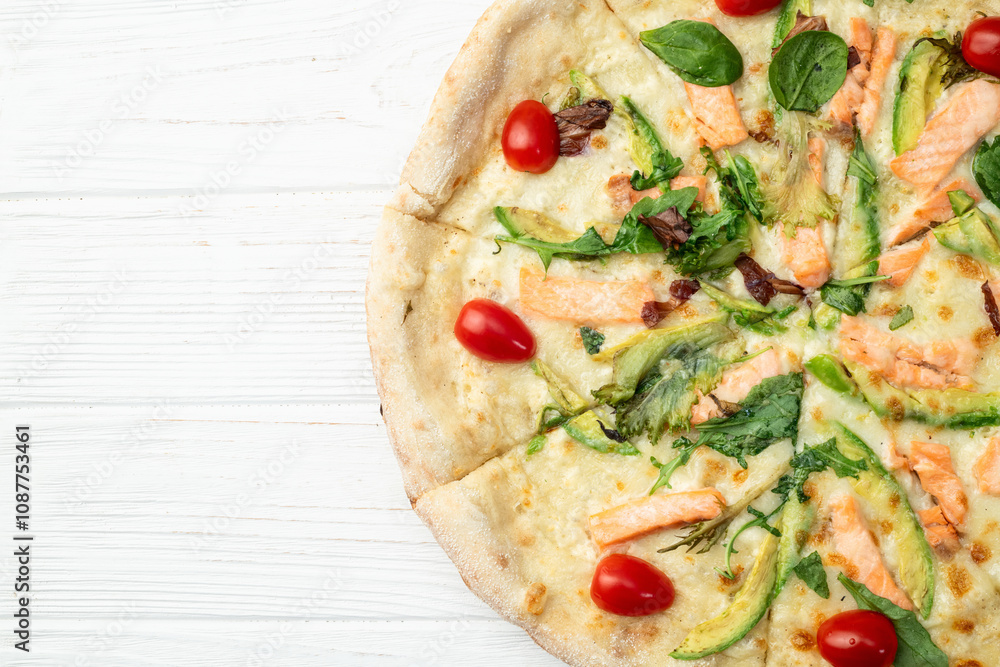 Italian pizza with avocado salmon tomatoes and mozzarella photography. top view Italian pizza with avocado salmon tomatoes and mozzarella photography. top view
