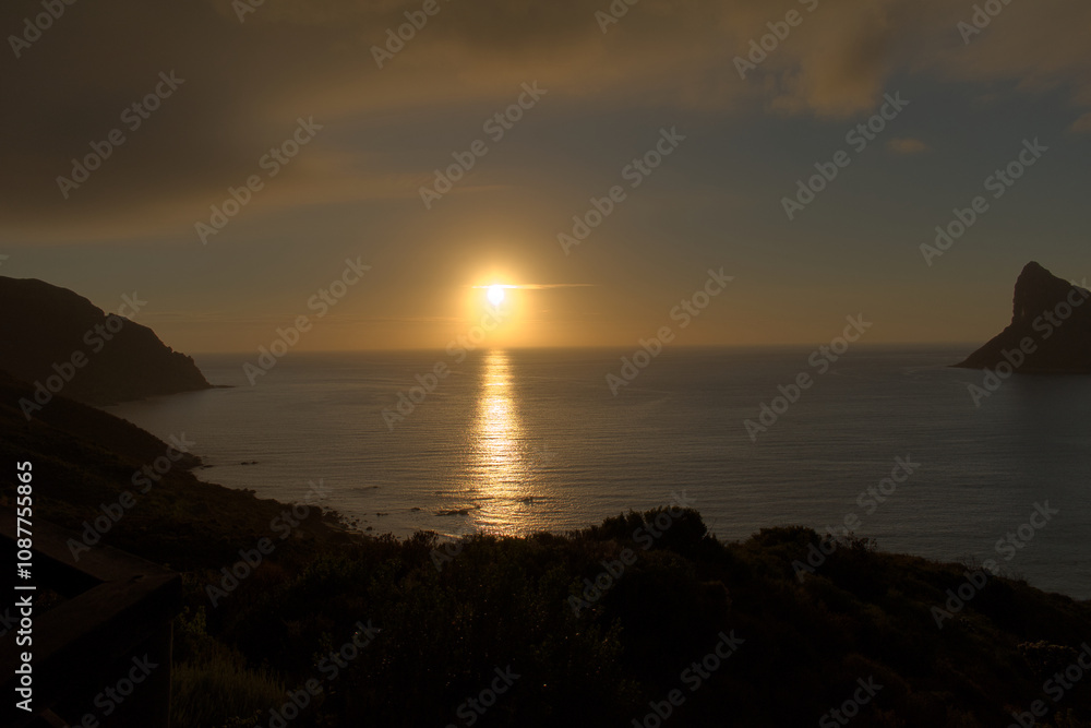 Sunset over the ocean as seen from Chapman's peak drive in Cape Town, South Africa Sunset over the ocean as seen from Chapman's peak drive in Cape Town, South Africa