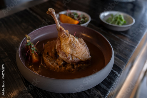 duck leg served on a specially prepared plate