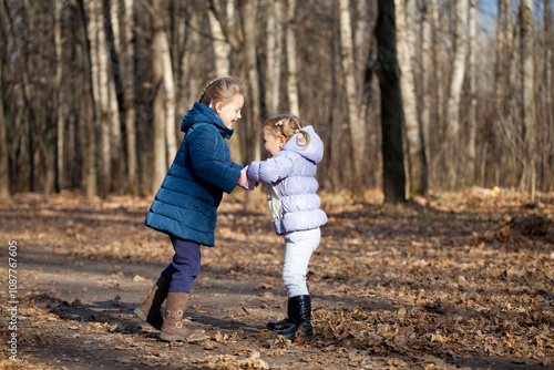 Two sisters in autumn park