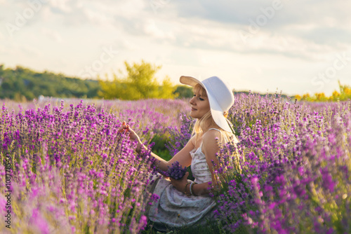 Woman in a lavender field. Selective focus.