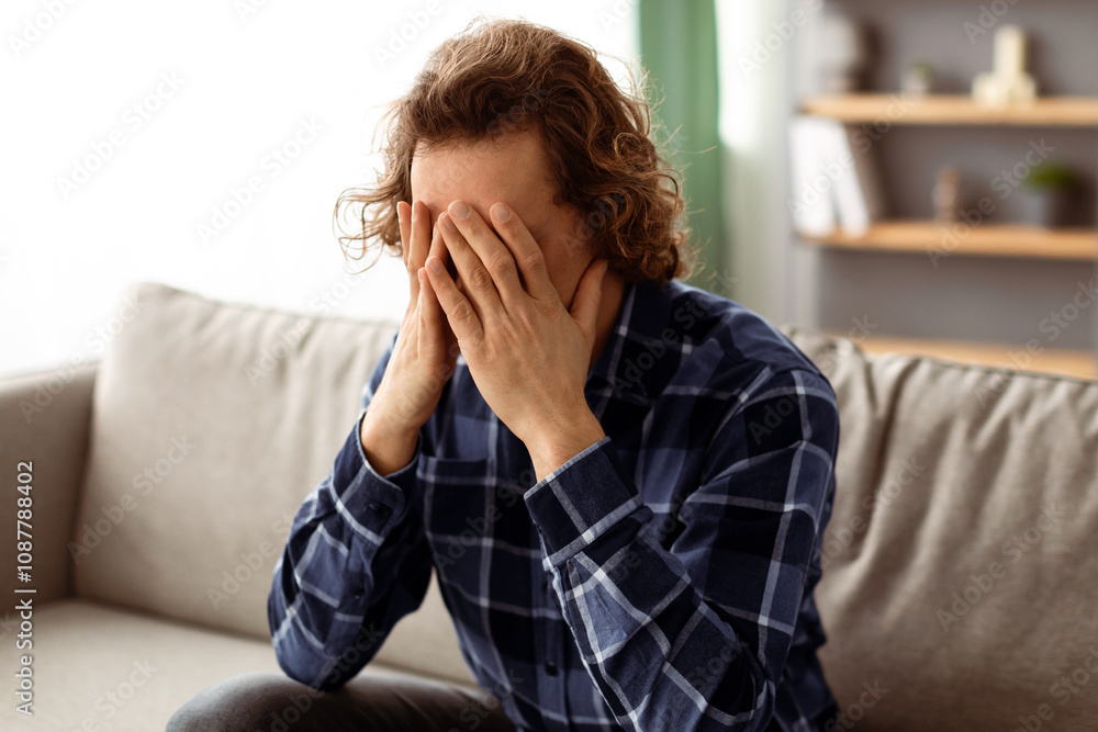 Depression. Unhappy Guy Covering Face Being Tired Of Unsolved Problems Sitting On Couch At Home. Unrecognizable Desperate Guy Crying In Living Room. Unhappiness And Stressful Male Life Concept Depression. Unhappy Guy Covering Face Being Tired Of Unsolved Problems Sitting On Couch At Home. Unrecognizable Desperate Guy Crying In Living Room. Unhappiness And Stressful Male Life Concept