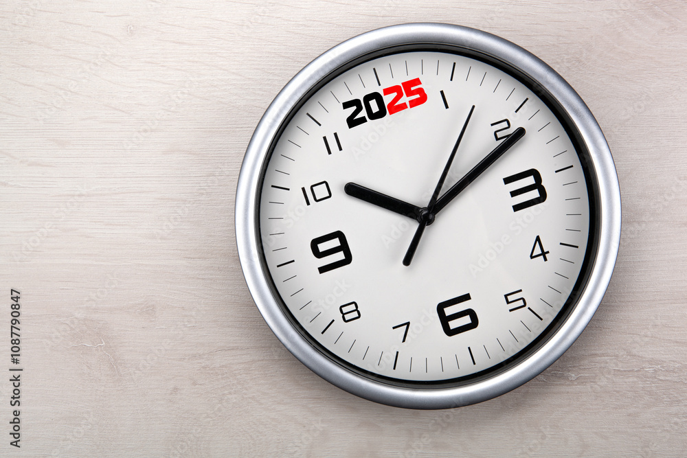 large white clock face with digits on a wooden background closeup large white clock face with digits on a wooden background closeup