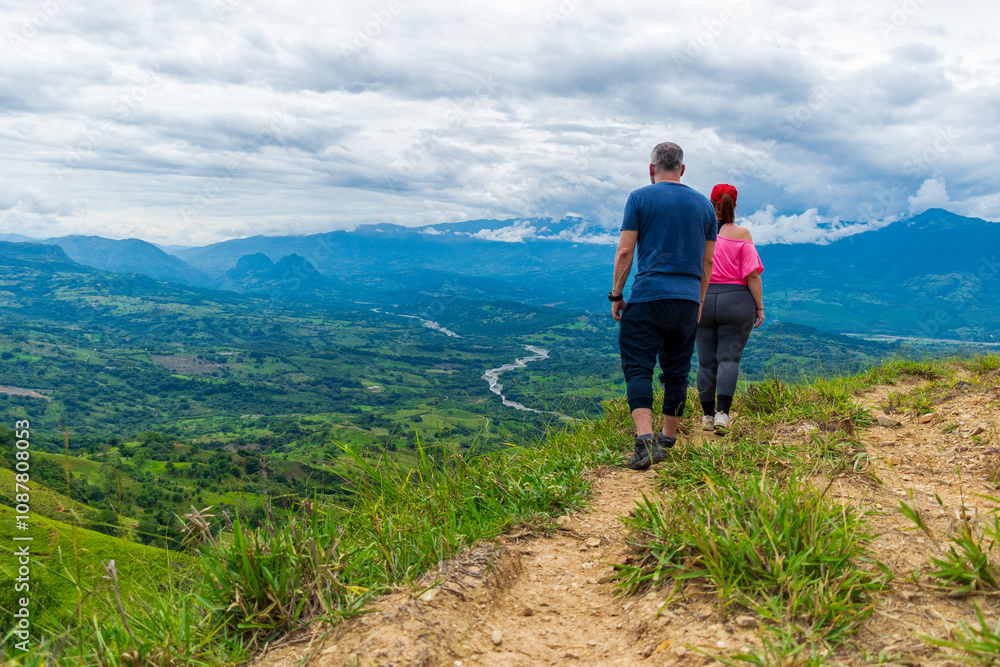 Latino male and female hikers enjoying the mountains in Colombia Latino male and female hikers enjoying the mountains in Colombia