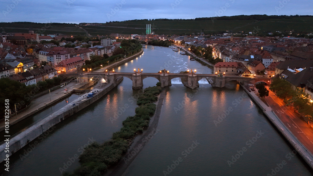Fototapeta premium Photos of The Old Main Bridge and Main River taken with a drone at before sunrise. 