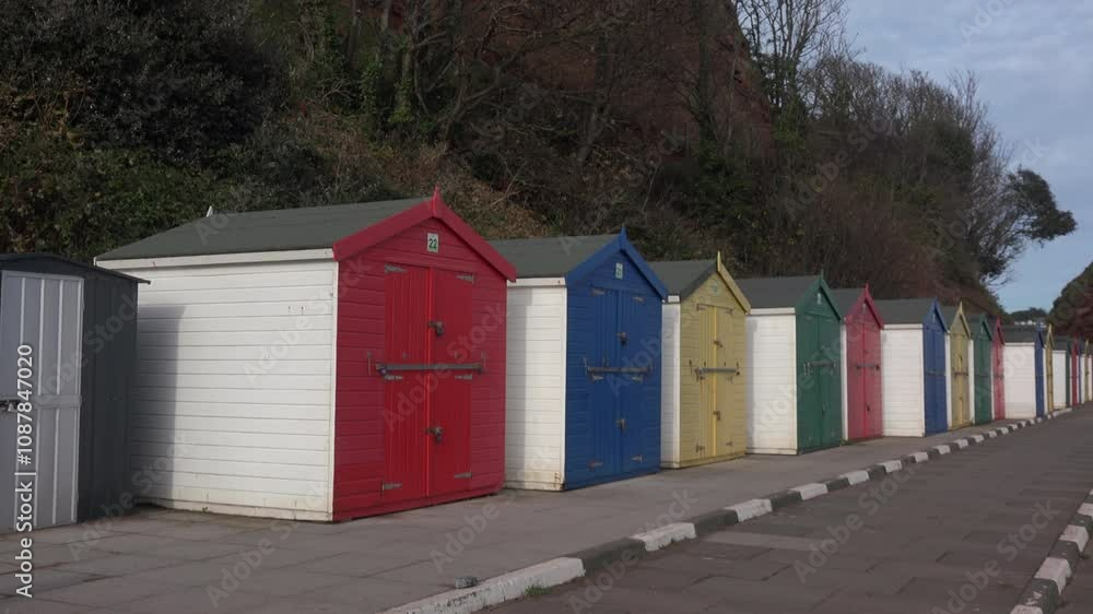 South coast of England beach huts for vacation in leisure time. Dawlish beach for thatcher's UK 4K South coast of England beach huts for vacation in leisure time. Dawlish beach for thatcher's UK 4K
