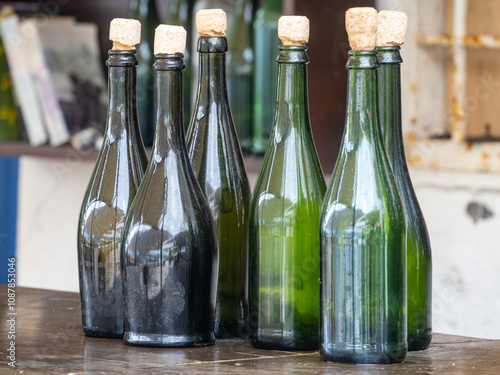 Empty green wine bottles with corks