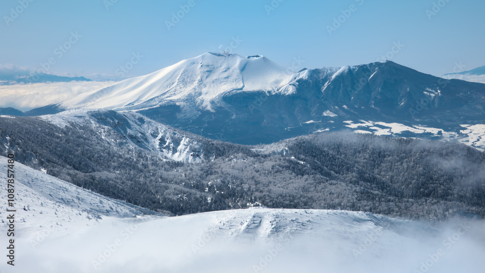 Steaming stratovolcano on a snowy landscape (Mount Asama, Japan) Steaming stratovolcano on a snowy landscape (Mount Asama, Japan)