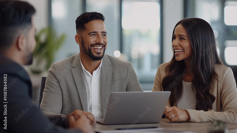 A professional yet friendly scene of a cheerful Hispanic real estate agent in a stylish blazer presenting a virtual house tour to a young Latinx couple on a laptop. The couple sits A professional yet friendly scene of a cheerful Hispanic real estate agent in a stylish blazer presenting a virtual house tour to a young Latinx couple on a laptop. The couple sits