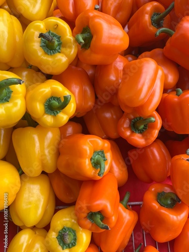 red and yellow peppers at the farmers market