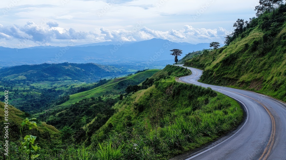 Winding Road through Lush Mountains Winding Road through Lush Mountains