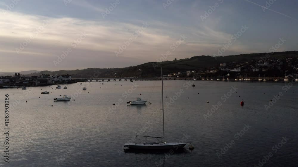 Teignmouth Devon aerial view from drone of pretty seaside town. South coast of England morning light harbour with boats in the English riviera UK 4K Teignmouth Devon aerial view from drone of pretty seaside town. South coast of England morning light harbour with boats in the English riviera UK 4K