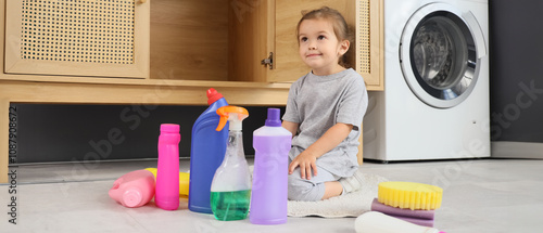 Little girl with bottles of...