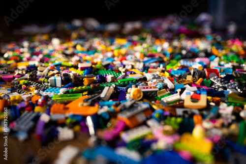 colorful plastic toys, bricks on a floor.