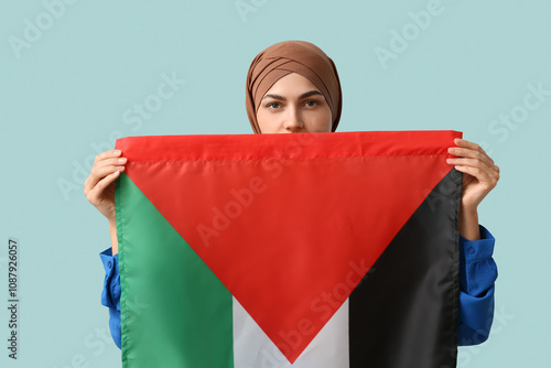 Young Muslim woman with Pal...