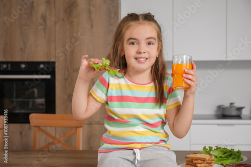 Cute little girl with tasty...