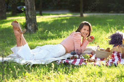 Beautiful young woman lying...