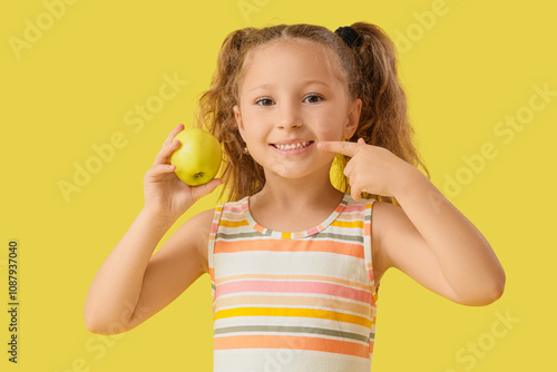 Cute little girl pointing a...