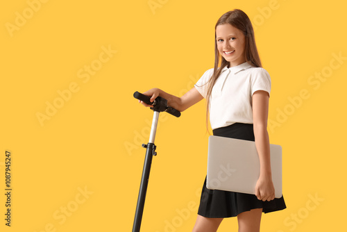 Cute schoolgirl with laptop...