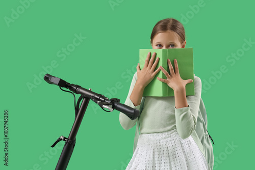 Cute schoolgirl with electr...