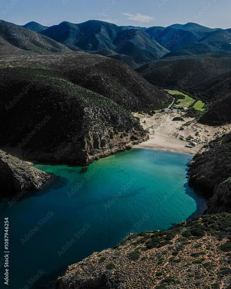 Crystal clear water in Cala Domestica in Sardinia. Drone shot among the heavenly rocks. Crystal clear water in Cala Domestica in Sardinia. Drone shot among the heavenly rocks.