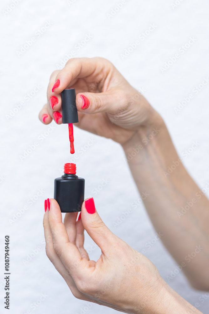 Photos women's hands holding nail polish