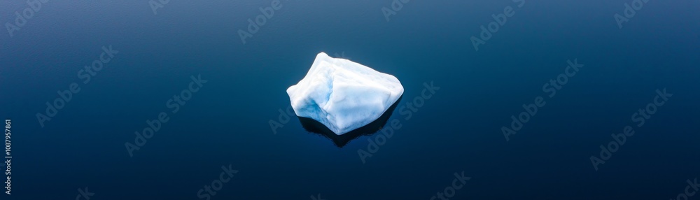 Melting iceberg in arctic waters aerial view nature photography environmental concept climate change awareness Melting iceberg in arctic waters aerial view nature photography environmental concept climate change awareness