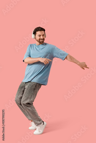 Happy young man in headphon...