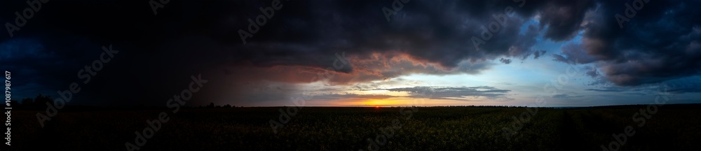 Summer sunset over wheat field. Beautiful sunset sky over countryside Summer sunset over wheat field. Beautiful sunset sky over countryside