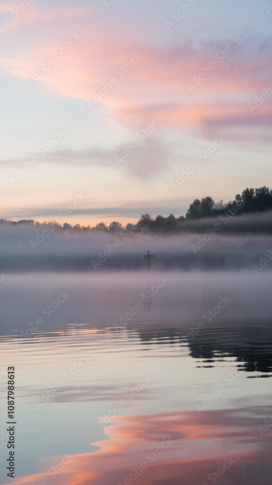 Scenic lakeside view with soft morning light. Calm lake view at sunrise with pastel sky wallpaper. Scenic lakeside view with soft morning light. Calm lake view at sunrise with pastel sky wallpaper.