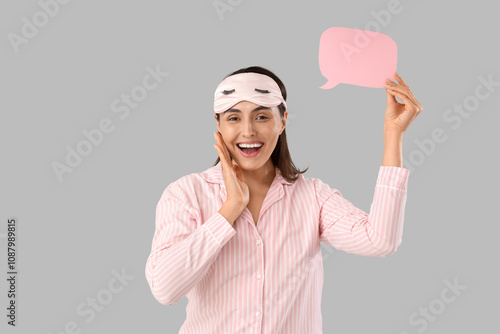Young woman in striped paja...