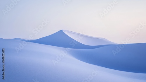 Serene landscape of soft, undulating snow-covered dunes.