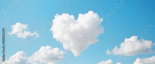 Heart-shaped cloud in bright blue sky, love and romance