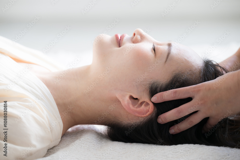 Close-up profile of banner with image of head massage or head spa on back Close-up profile of banner with image of head massage or head spa on back