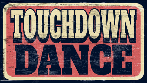 Aged and worn touchdown dance sign on wood
