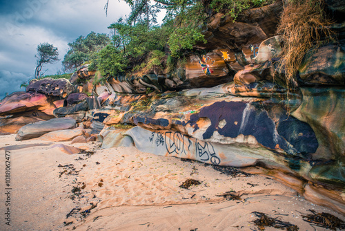 Graffiti rocks in the beach photo