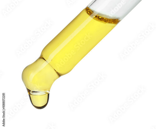 Dripping essential oil from pipette on white background