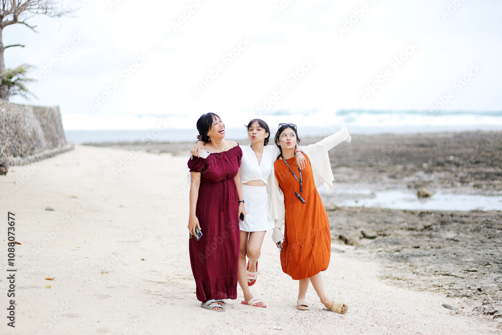 Group of Three Friends is Having Fun Against Sunset Beach. Beach Holidays Concept
Group of Three Friends is Having Fun Against Sunset Beach. Beach Holidays Concept