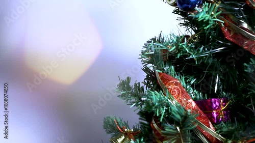 Christmas tree detail with blurred blinking lights.