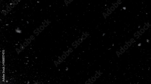 Falling snow at nigh. On dark background.