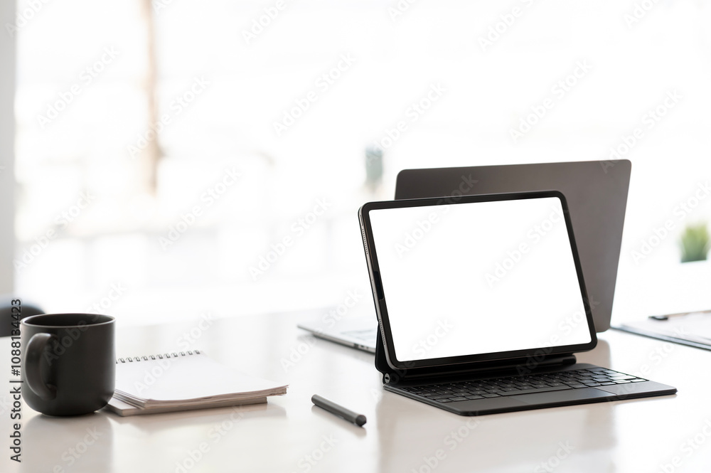 Digital tablet blank screen on the desk with coffee and book pencils at the office. Digital tablet blank screen on the desk with coffee and book pencils at the office.