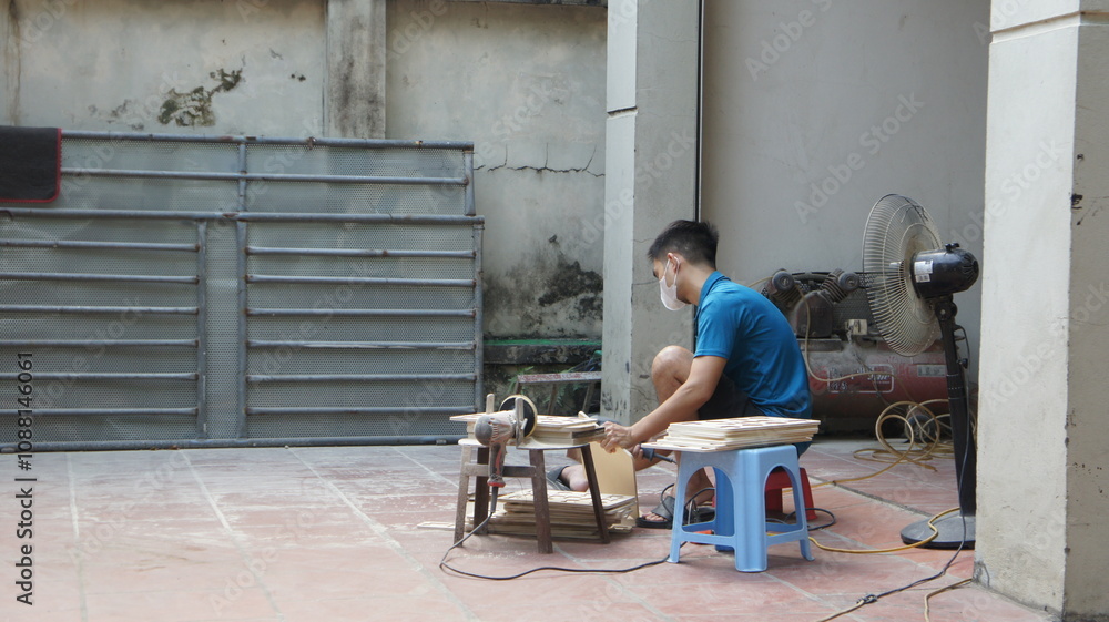 Craftsman Working on Wood in a Vietnamese Backyard Workshop Craftsman Working on Wood in a Vietnamese Backyard Workshop