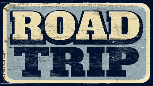 Aged vintage road trip sign on wood
